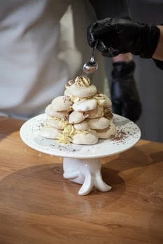 pastry chef decorating elegant dessert